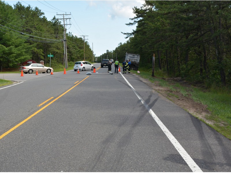 Dump Truck Takes Out Light Pole But Avoids Serious Crash In Manchester