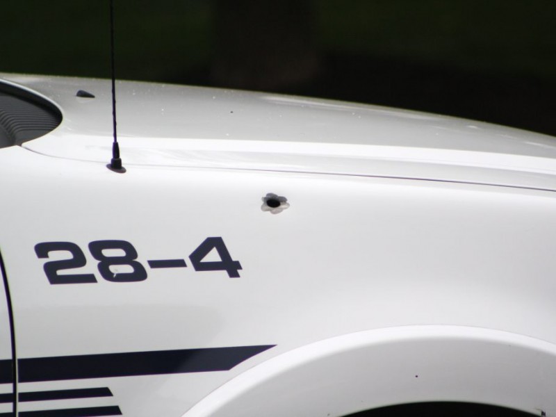 Bearcat Survived Standoff; Police Cars Did Not